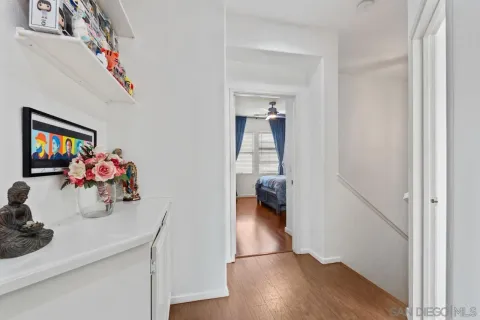 a bedroom with a bed closet and a window