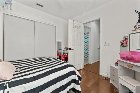 a living room with furniture a table and large windows