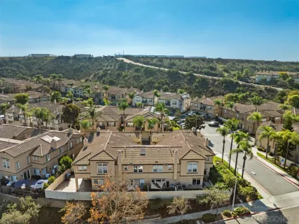 an aerial view of residential building and parking space