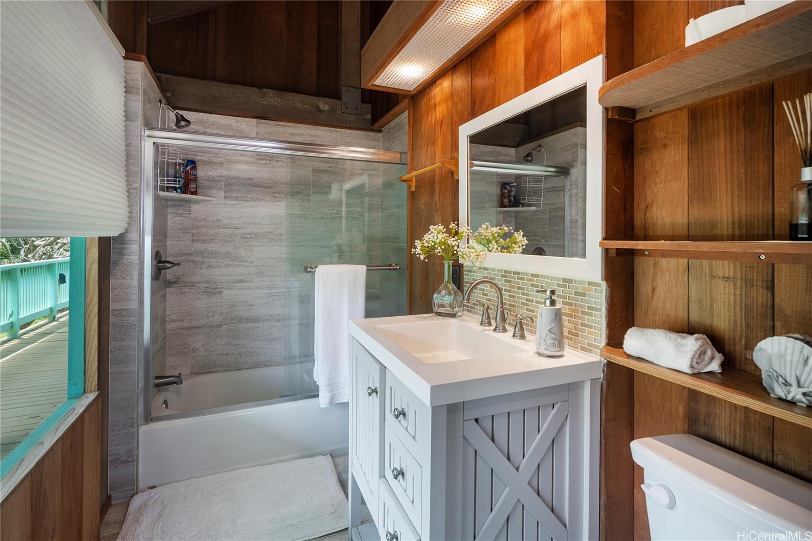 67-421 Waialua Beach Road Waialua, HI 96791 - Photo 15 of 25 a bathroom with a sink a toilet and shower