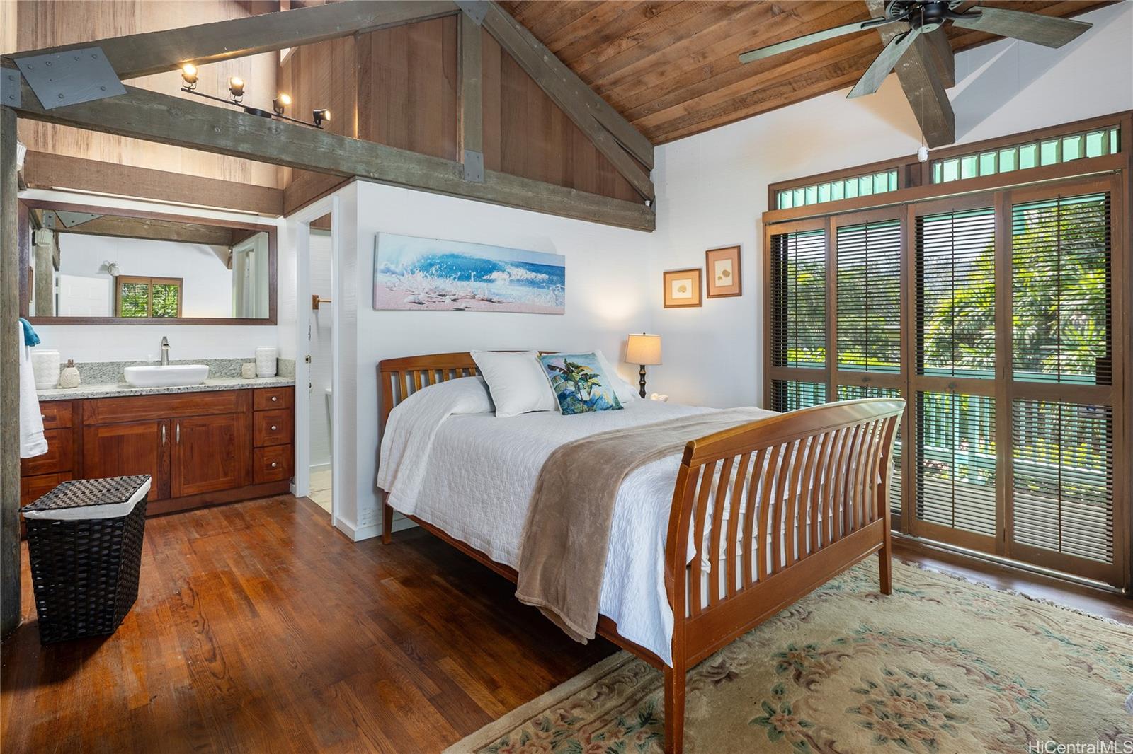 67-421 Waialua Beach Road Waialua, HI 96791 - Photo 19 of 25 a bedroom with a bed and a window