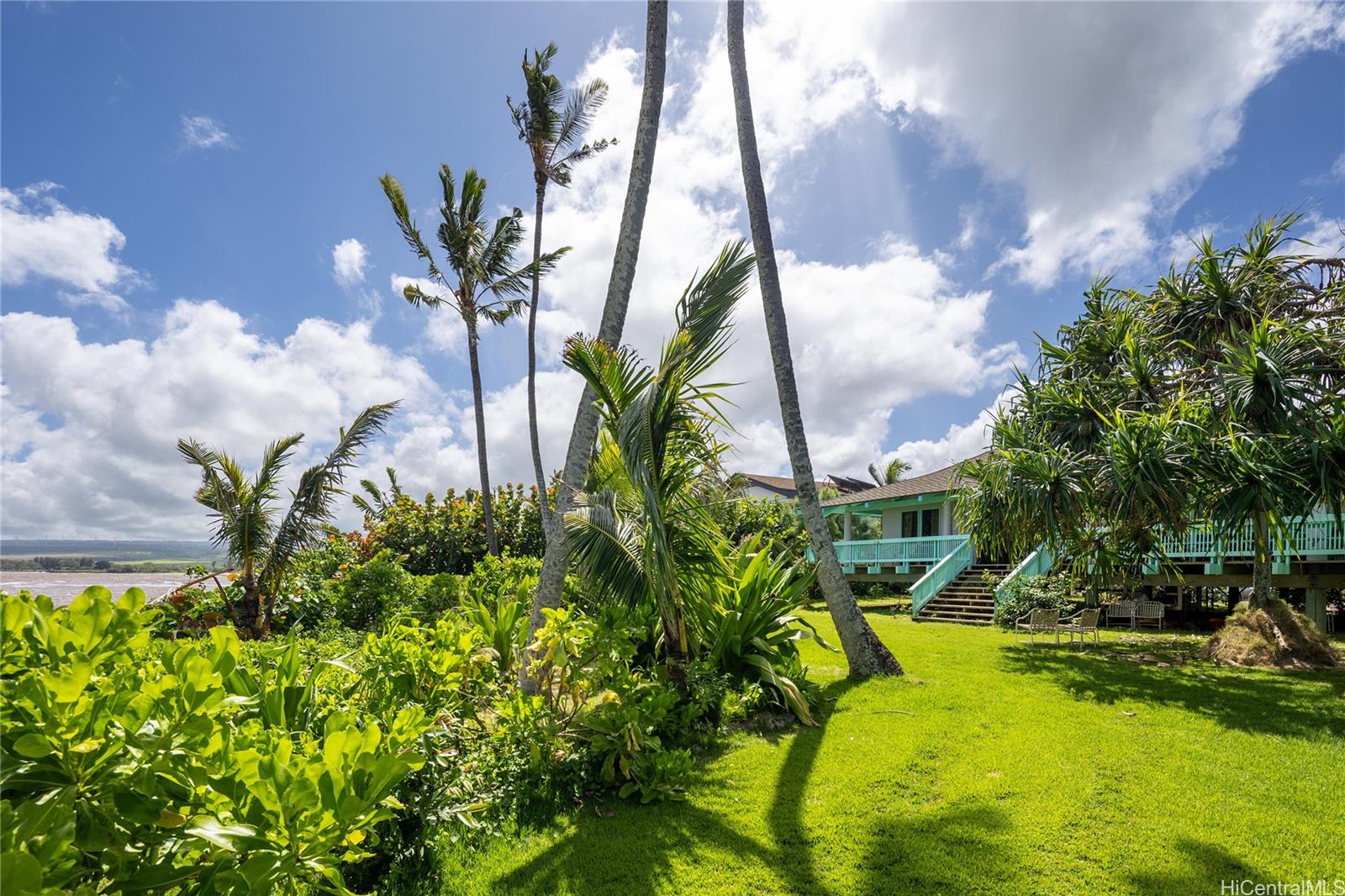 67-421 Waialua Beach Road Waialua, HI 96791 - Photo 4 of 25 a view of a swimming pool with a yard