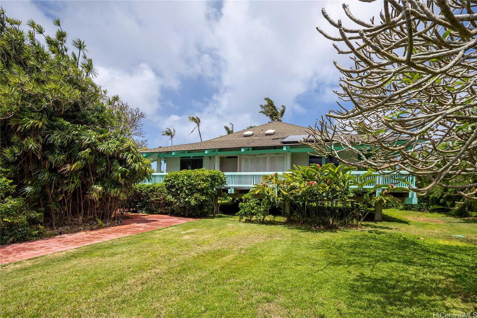 67-421 Waialua Beach Road Waialua, HI 96791 - Photo 7 of 25 a front view of a house with a yard