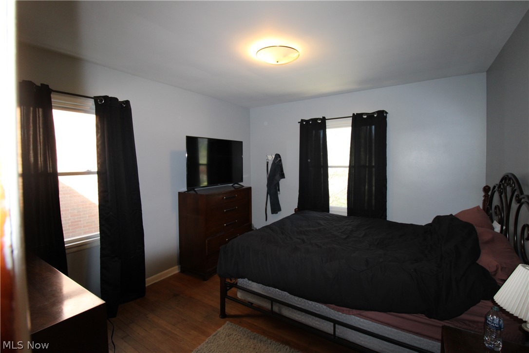 18800 Neff Road Cleveland, OH 44119 - Photo 17 of 38 Bedroom featuring multiple windows and dark hardwood / wood-style floors