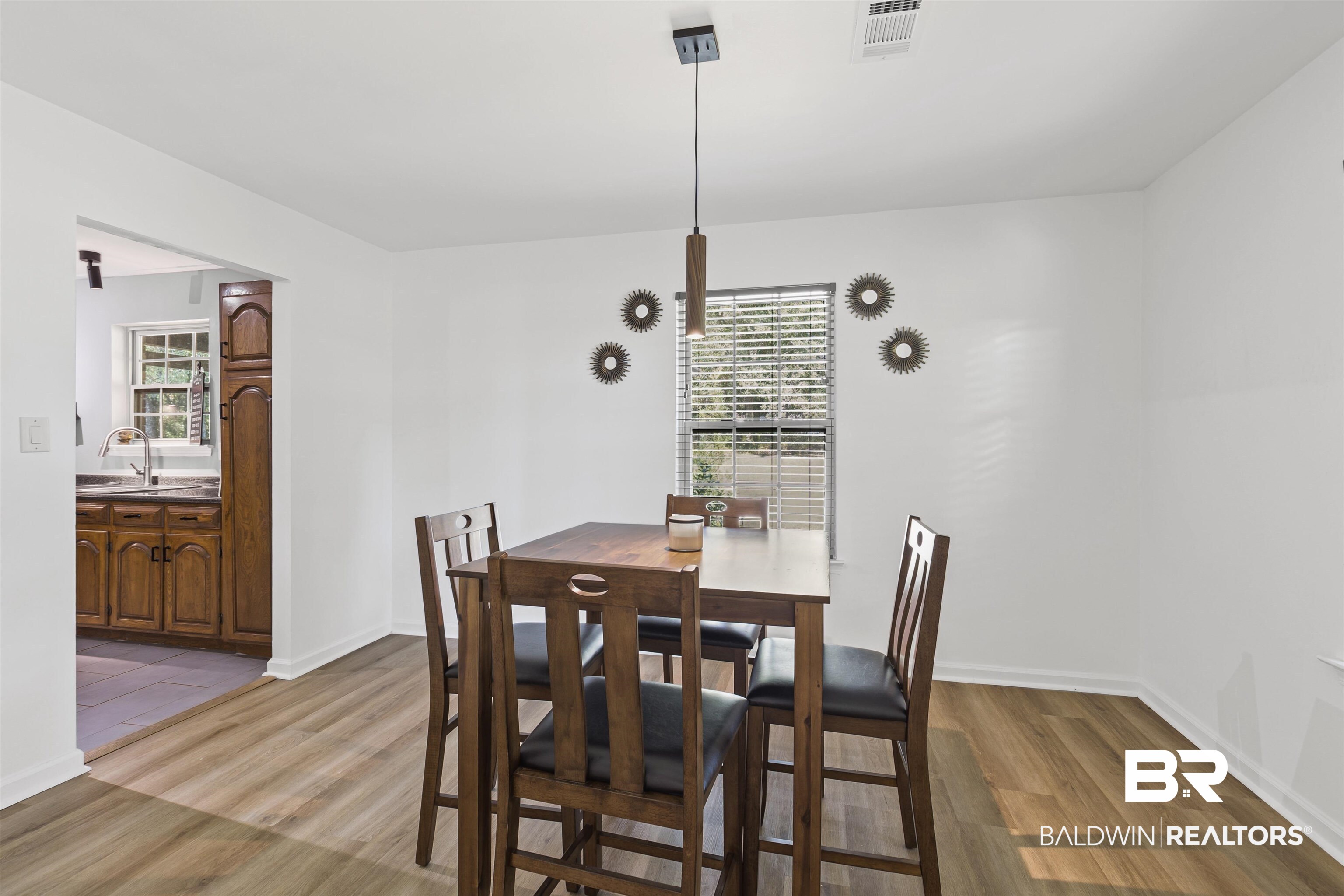 8911 Owassa Road Evergreen, AL 36401 - Photo 6 of 24 Dining room with light wood-style flooring