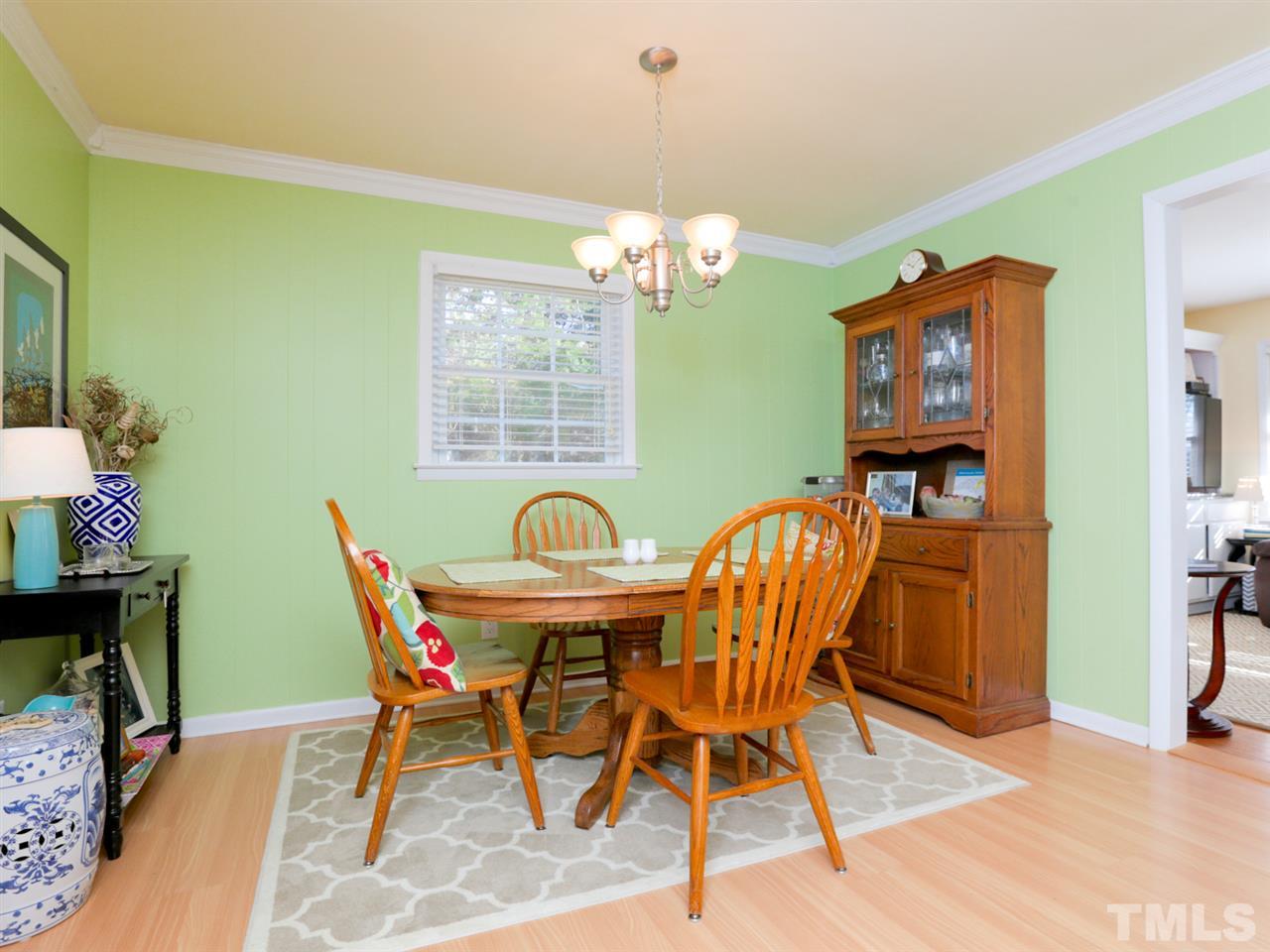 403 Kevin Circle Raleigh, NC 27609 - Photo 11 of 25 a view of a dining room with furniture and a chandelier