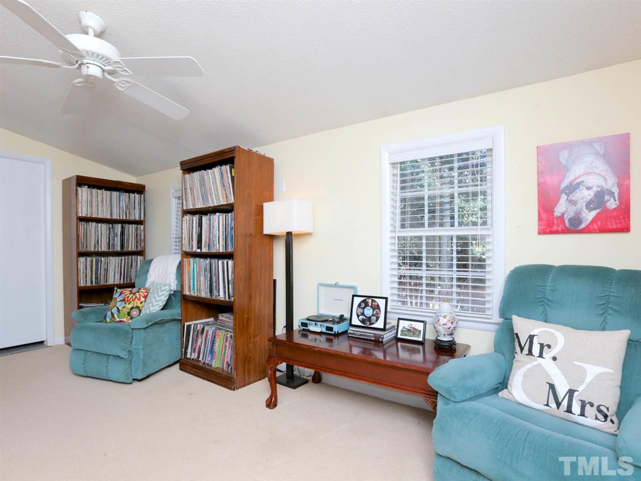 403 Kevin Circle Raleigh, NC 27609 - Photo 12 of 25 a living room with furniture and a book shelf