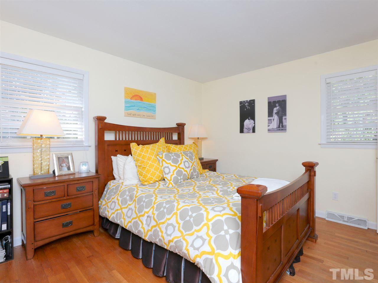 403 Kevin Circle Raleigh, NC 27609 - Photo 14 of 25 a bed room with a bed and a window