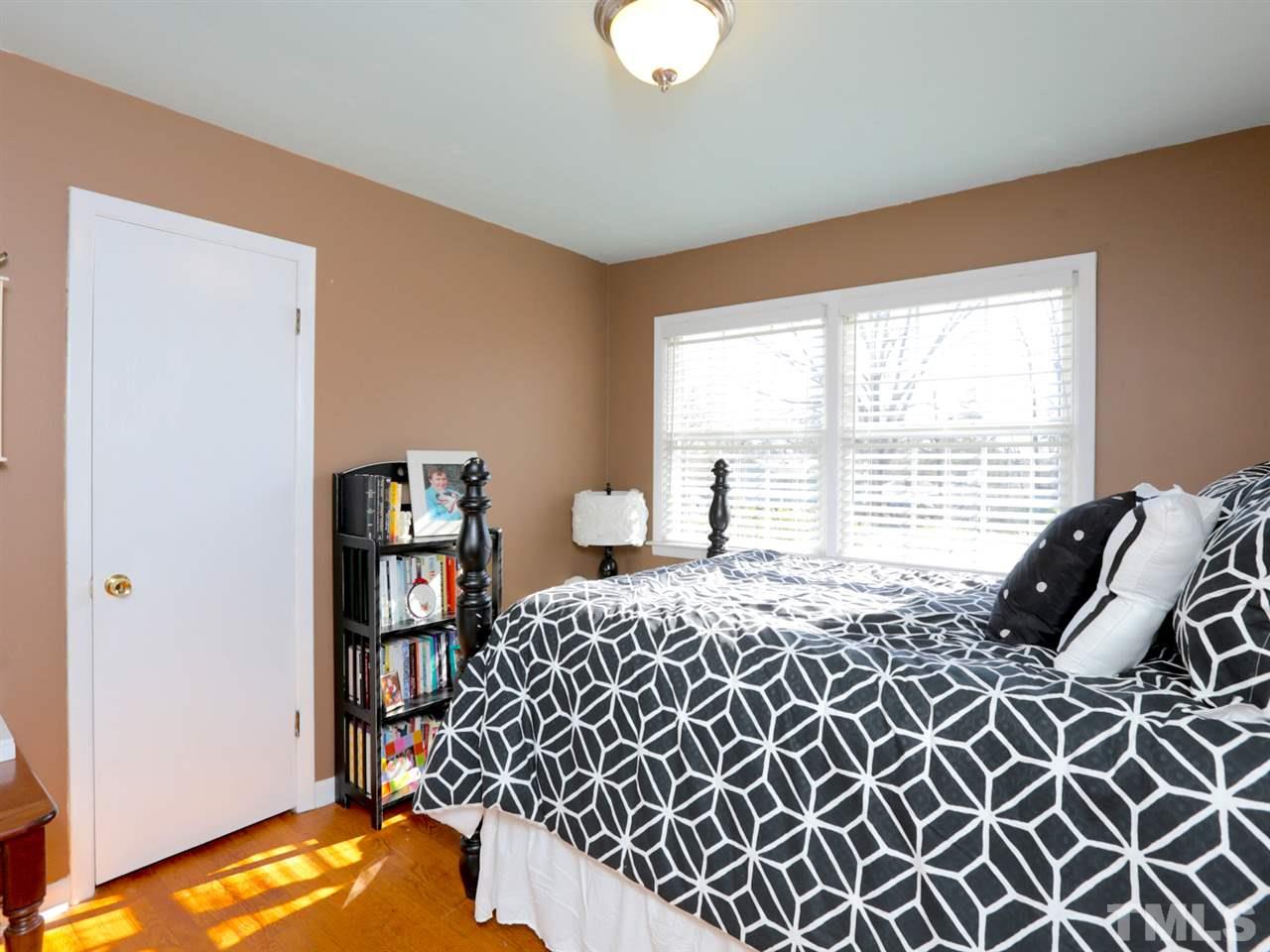 403 Kevin Circle Raleigh, NC 27609 - Photo 19 of 25 a bedroom with a bed and a window
