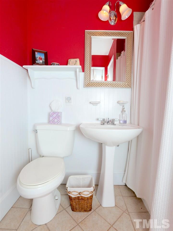 403 Kevin Circle Raleigh, NC 27609 - Photo 20 of 25 a bathroom with a toilet sink and mirror