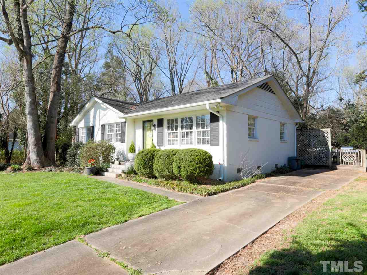 403 Kevin Circle Raleigh, NC 27609 - Photo 3 of 25 a front view of a house with a yard and potted plants