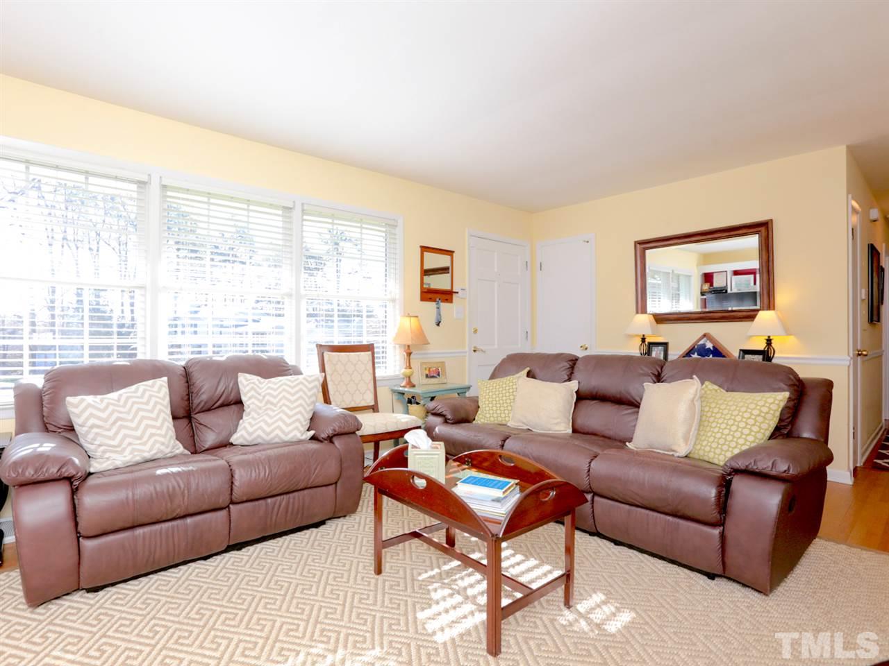 403 Kevin Circle Raleigh, NC 27609 - Photo 4 of 25 a living room with furniture and a large window
