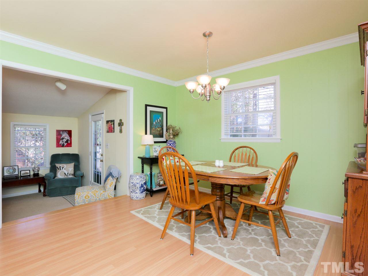 403 Kevin Circle Raleigh, NC 27609 - Photo 10 of 25 a view of a dining room with furniture and chandelier