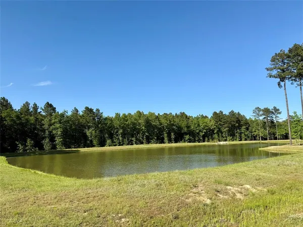 a view of a lake with a big yard