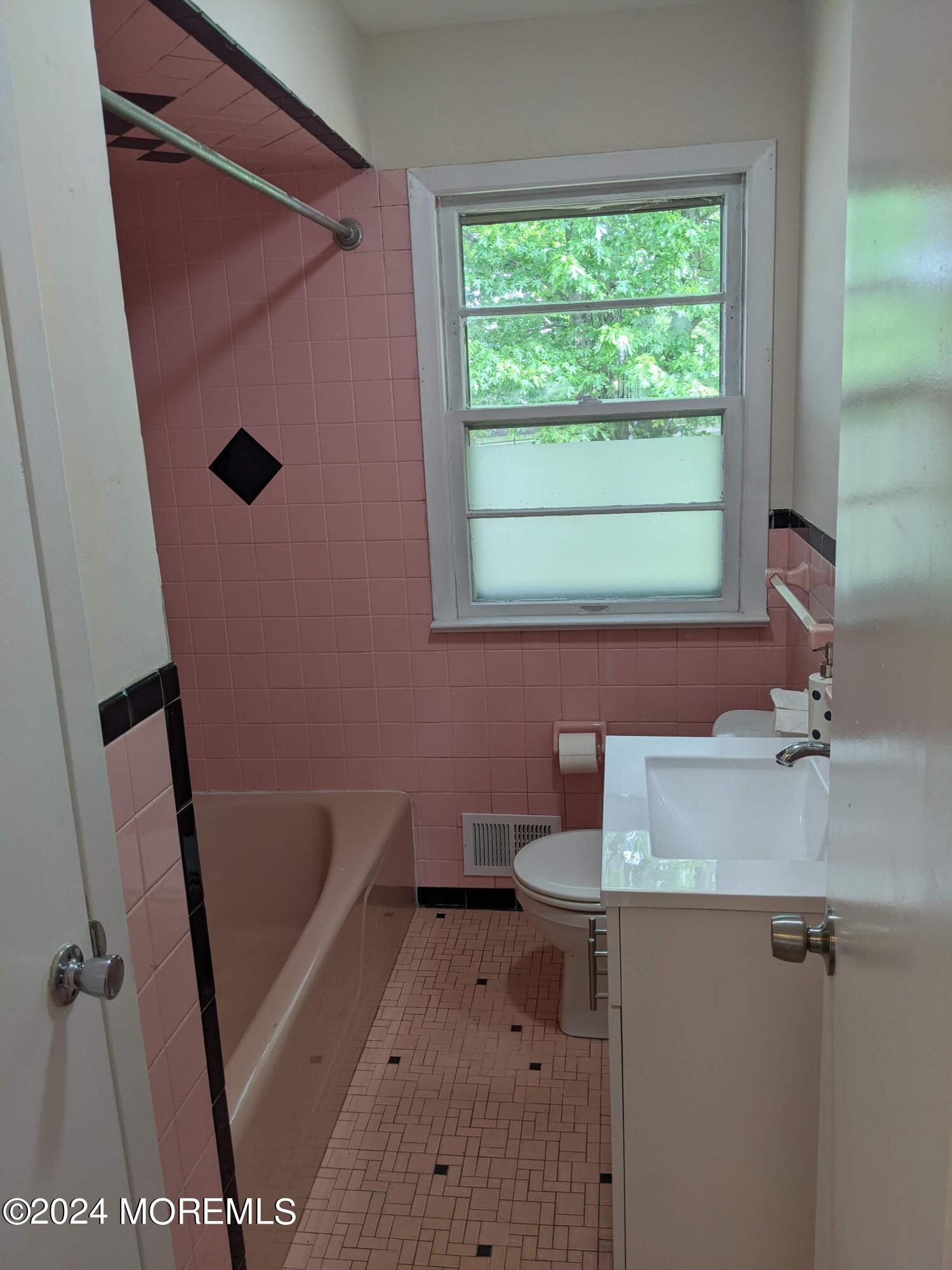 509 Stone Road Union Beach, NJ 07735 - Photo 12 of 16 a bathroom with a sink and a vanity