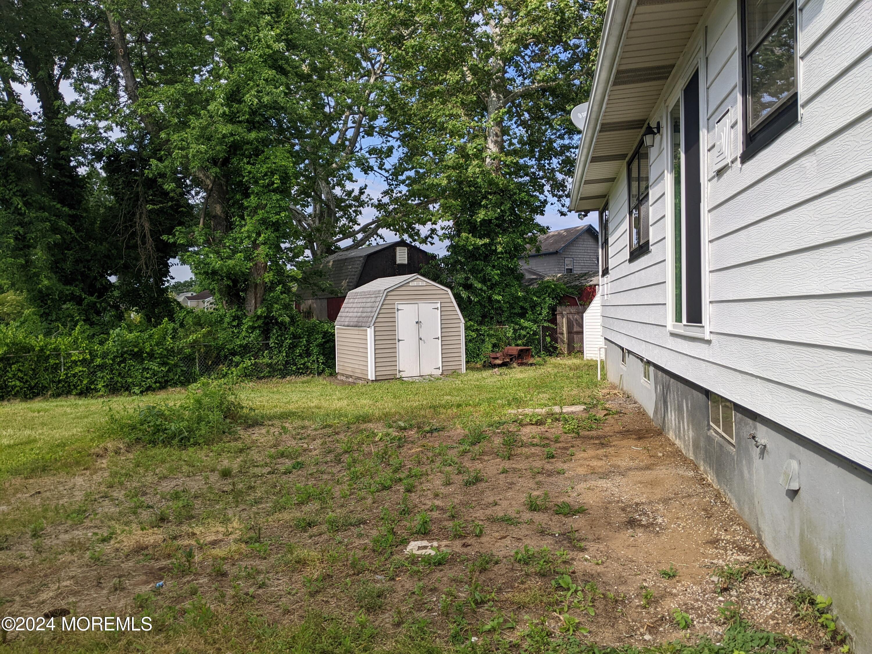 509 Stone Road Union Beach, NJ 07735 - Photo 14 of 16 a view of a backyard