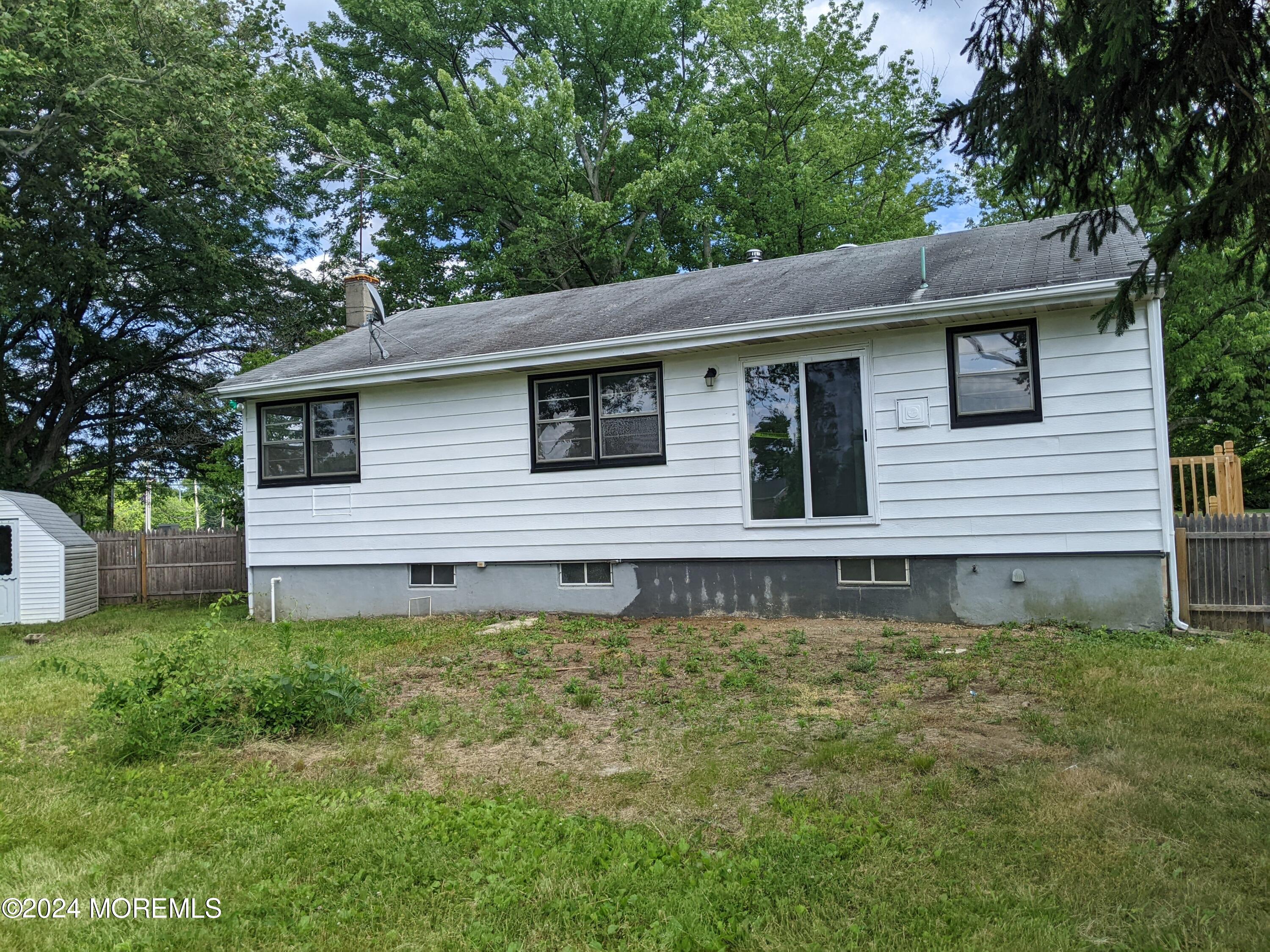 509 Stone Road Union Beach, NJ 07735 - Photo 15 of 16 a house that has a lot of plants in it
