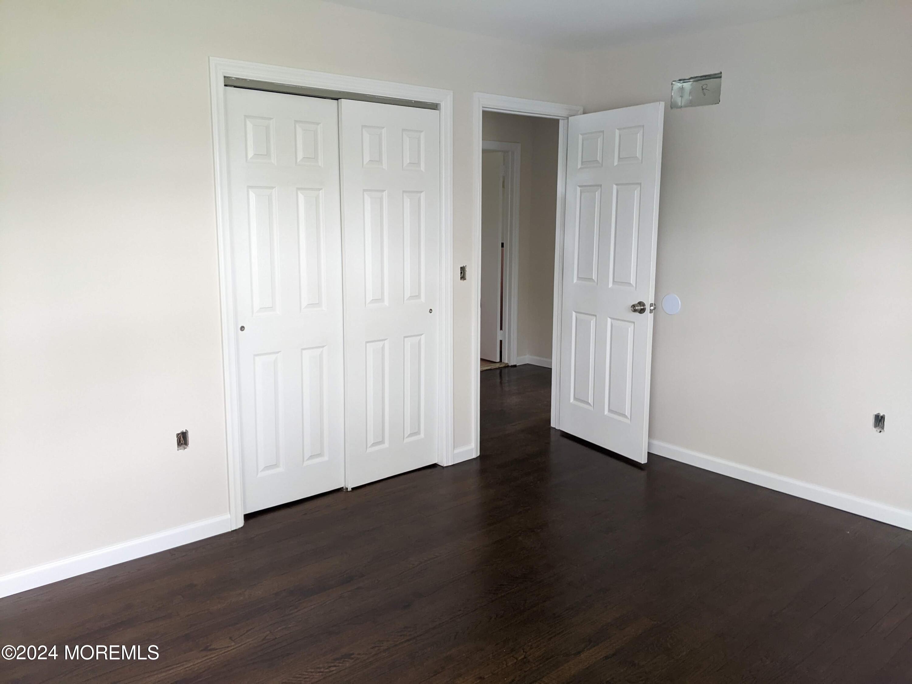 509 Stone Road Union Beach, NJ 07735 - Photo 9 of 16 an empty room with wooden floor