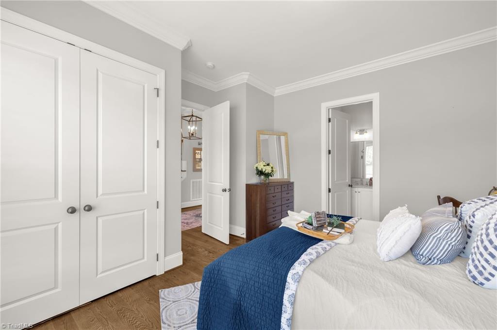 4262 Bridgehead Road Kernersville, NC 27284 - Photo 22 of 50 Guest Suite Alternate View – Comfortably sized with private bath access, double closet, and stylish décor perfect for overnight guests or multigenerational living.