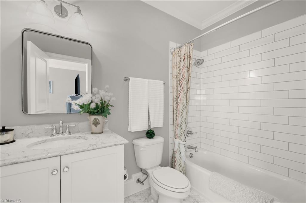 4262 Bridgehead Road Kernersville, NC 27284 - Photo 27 of 50 Upstairs Bath – Elegant full bath with marble countertop, subway-tile shower surround, and polished chrome fixtures for a timeless appeal.