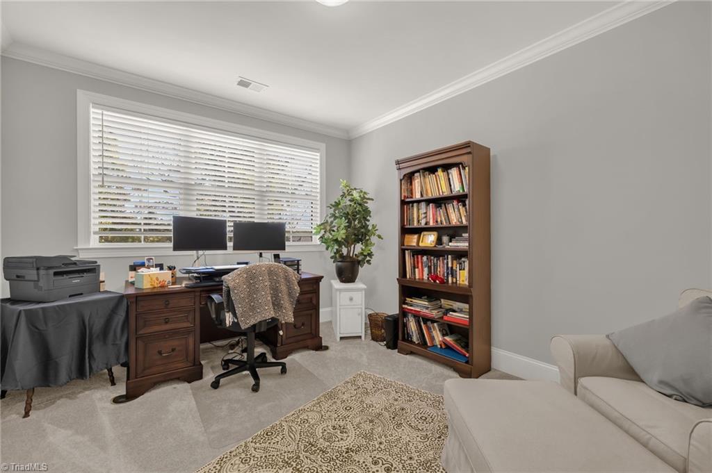 4262 Bridgehead Road Kernersville, NC 27284 - Photo 28 of 50 Home Office – Quiet, light-filled home office with oversized window, crown molding, and space for multiple workstations — ideal for remote work or study. Also has a closet.