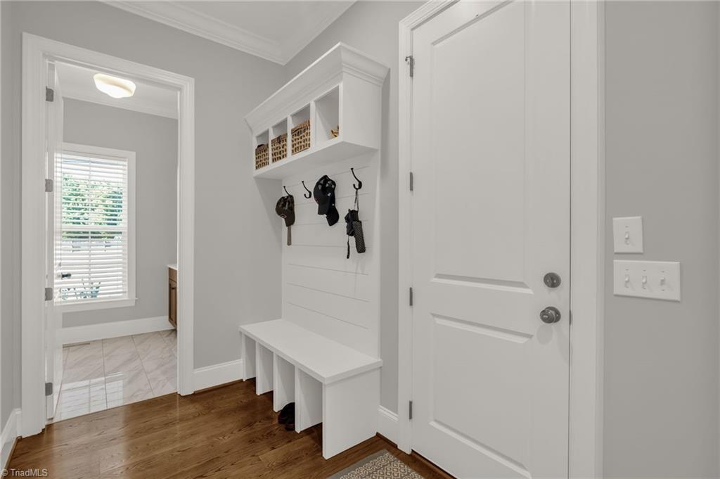 4262 Bridgehead Road Kernersville, NC 27284 - Photo 35 of 50 Mudroom Drop Zone – Convenient built-in bench with cubbies and hooks keeps everyday essentials organized by the garage entry.