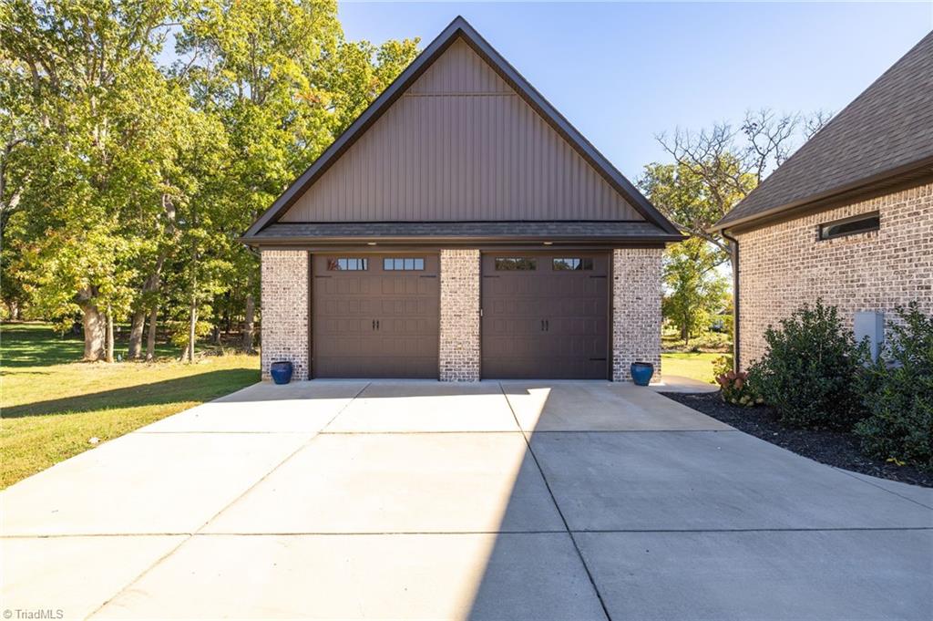 4262 Bridgehead Road Kernersville, NC 27284 - Photo 44 of 50 Detached Garage – Oversized two-car detached garage/shop provides additional parking, storage, or workspace options to complement the three-car attached garage.