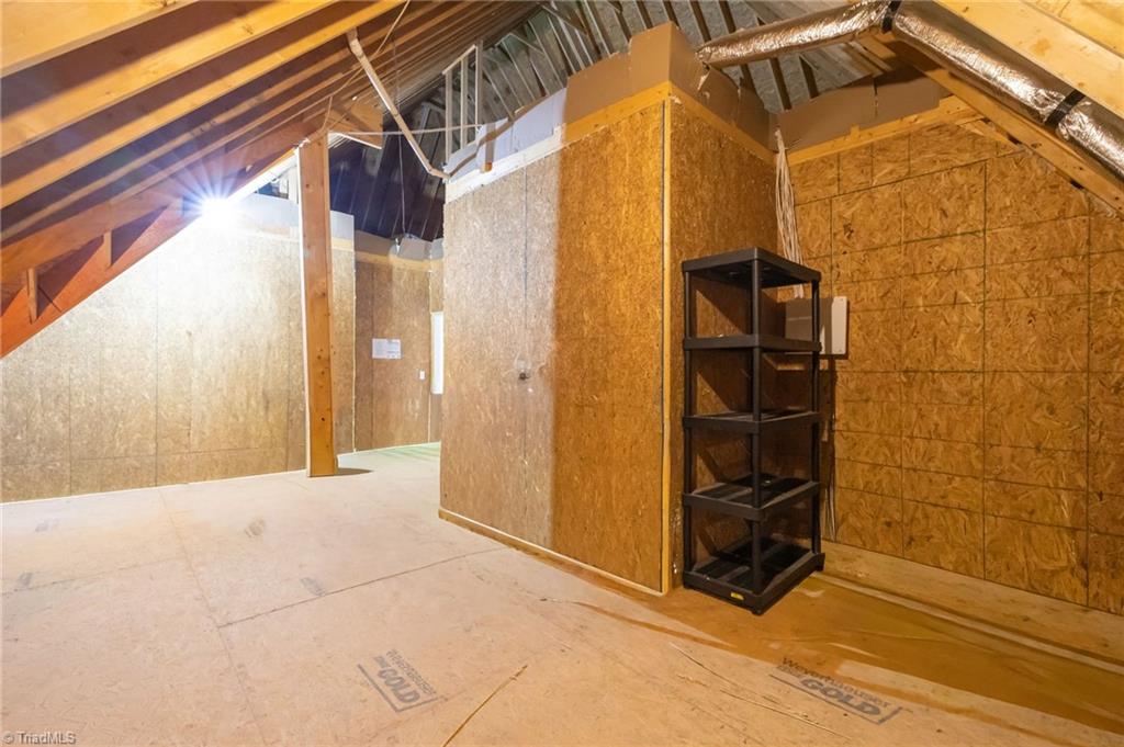 4262 Bridgehead Road Kernersville, NC 27284 - Photo 45 of 50 Walk-In Attic Storage – One of three large walk-in attic storage areas, offering abundant space for seasonal décor, hobby supplies, or future expansion.