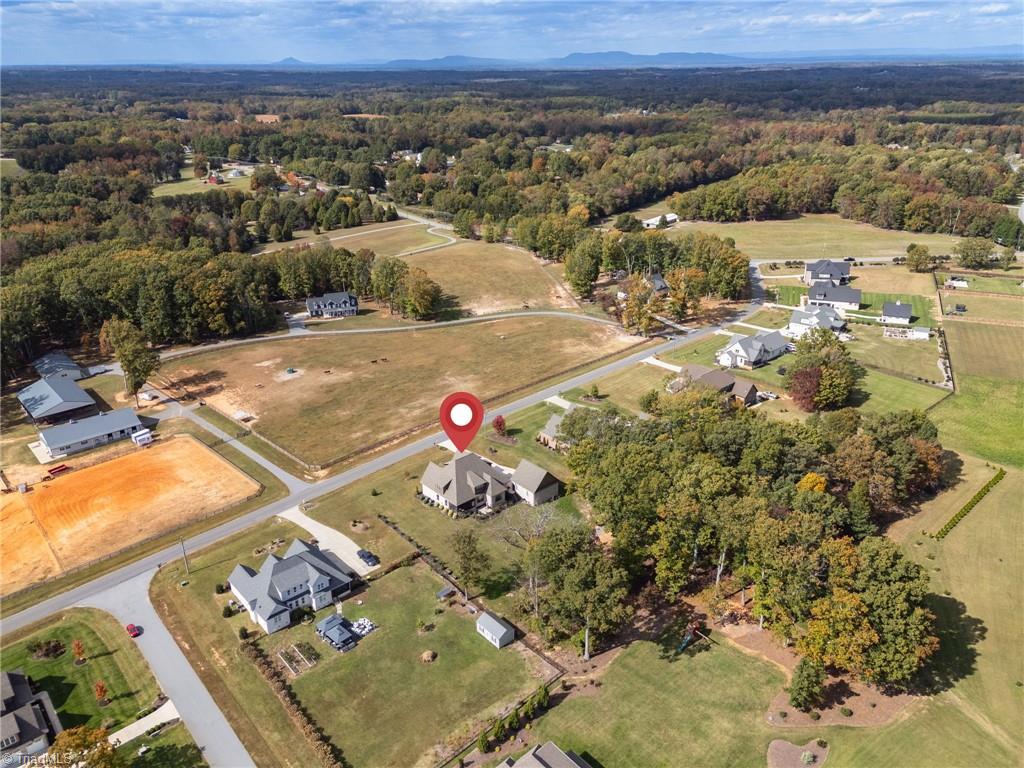 4262 Bridgehead Road Kernersville, NC 27284 - Photo 48 of 50 Aerial Neighborhood View – Peaceful setting surrounded by other custom-built homes in a well-maintained community with scenic countryside backdrops.
