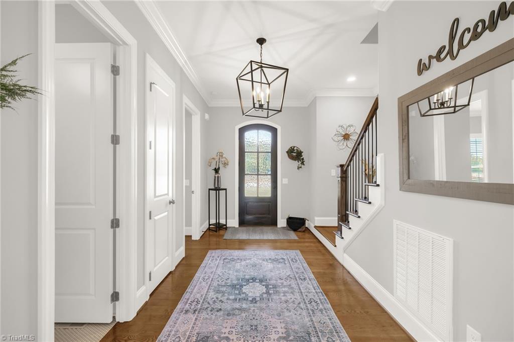 4262 Bridgehead Road Kernersville, NC 27284 - Photo 7 of 50 Entry View – The elegant foyer leads seamlessly into the main living areas, enhanced by natural light and neutral design tones.