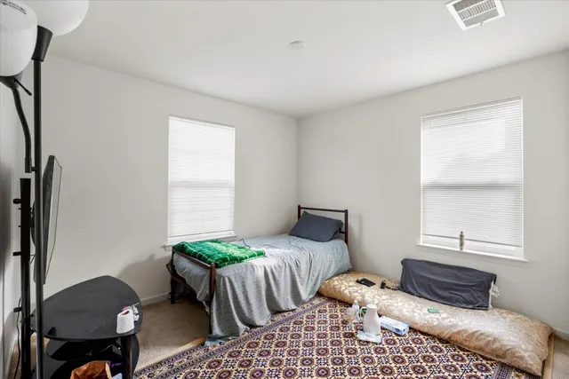 a bedroom with furniture and a bed