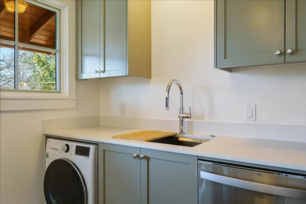 a kitchen with a sink and a stove