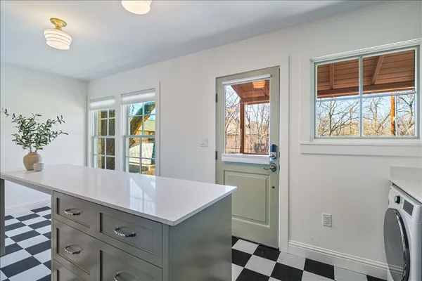 a kitchen with a stove and a microwave