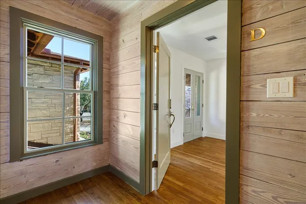 a view of a door with wooden floor