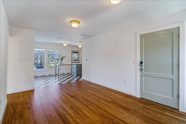 a view of a brick house with a door and a window