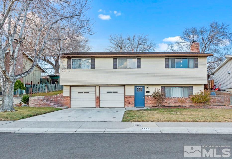 1775 Carlin Street Reno, NV 89503 - Photo 1 of 20 front view of house with a yard