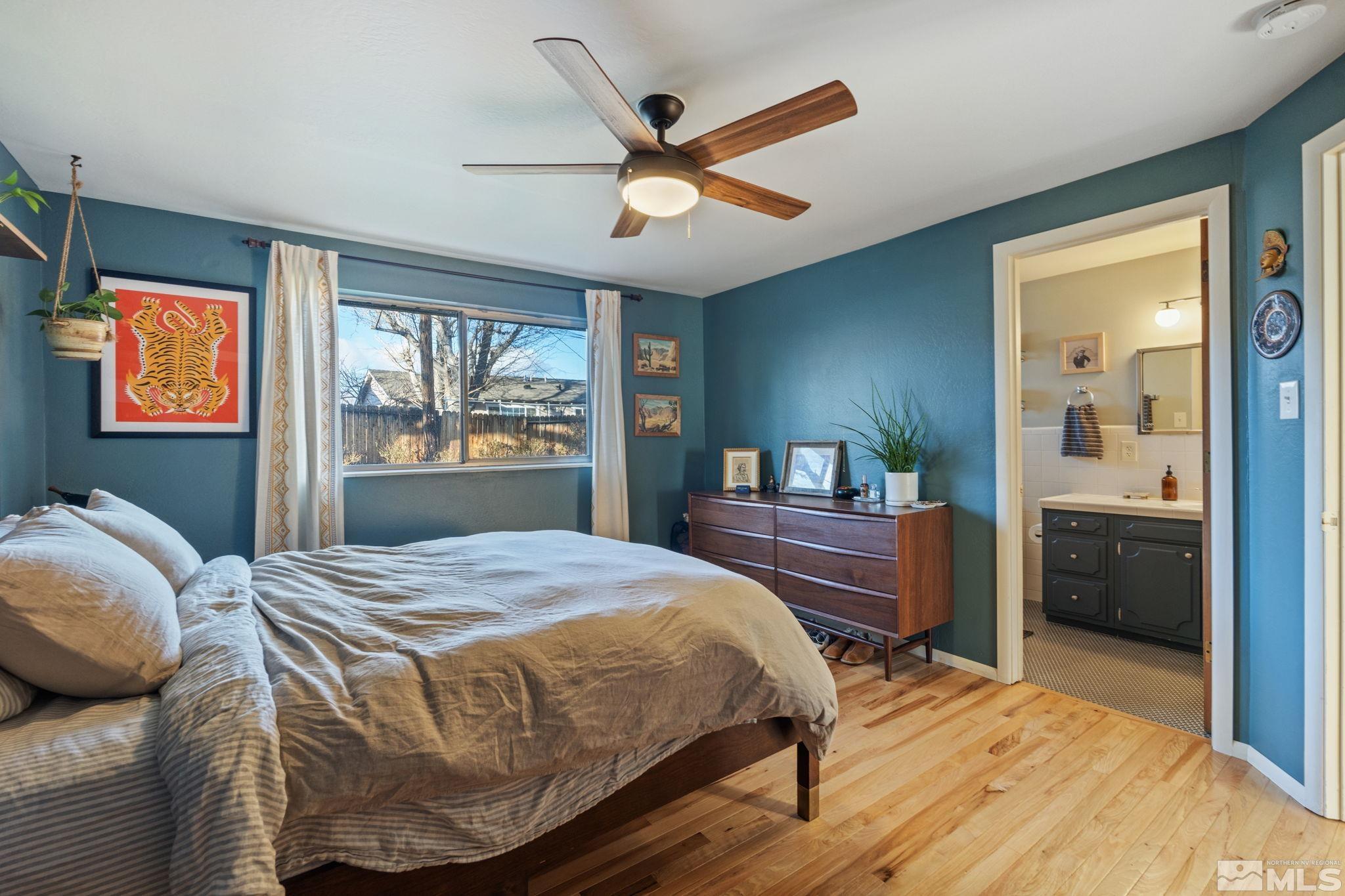 1775 Carlin Street Reno, NV 89503 - Photo 12 of 20 a bedroom with a bed and a dresser