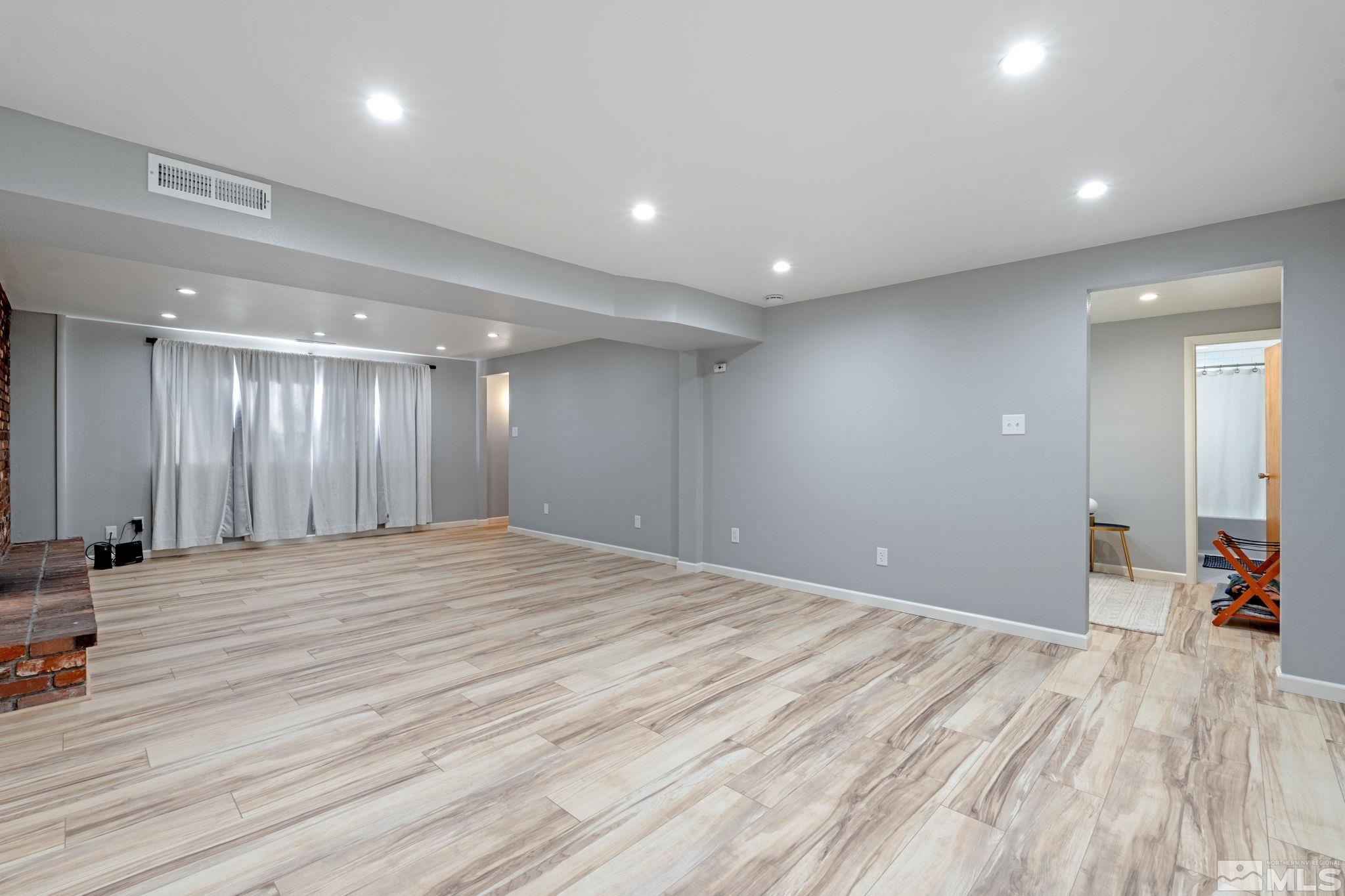 1775 Carlin Street Reno, NV 89503 - Photo 15 of 20 a view of an empty room with wooden floor
