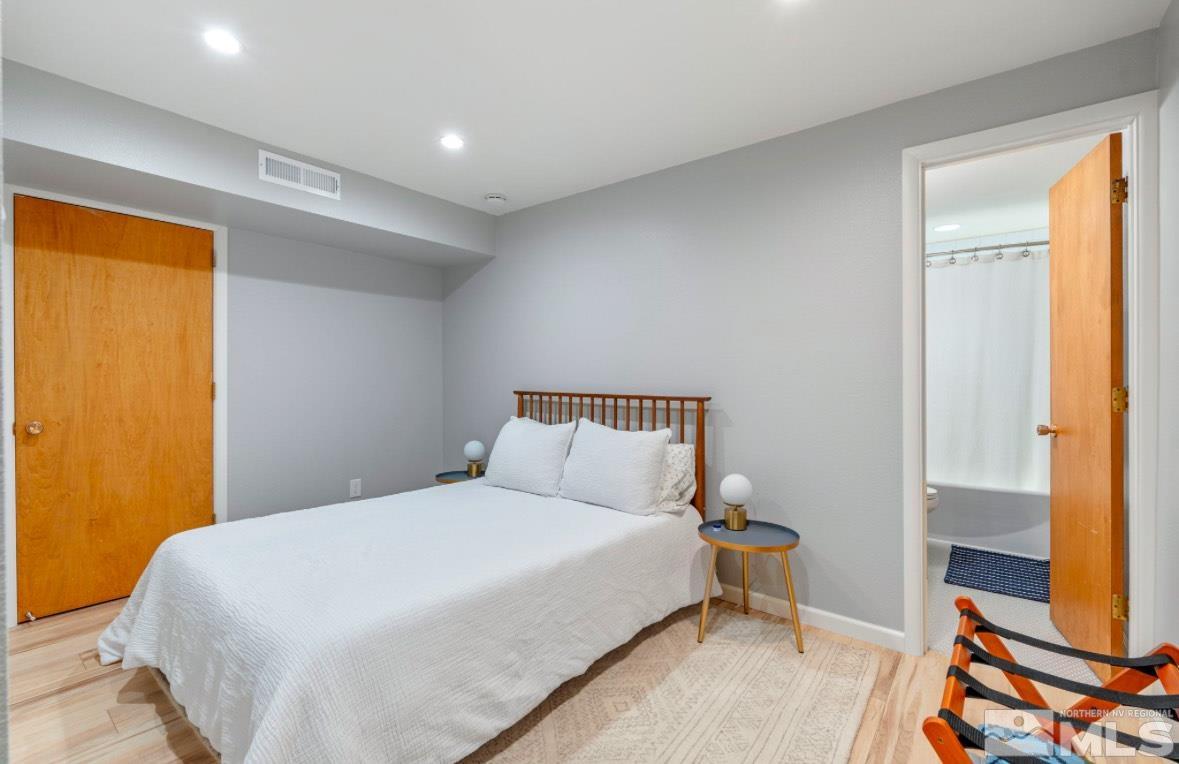1775 Carlin Street Reno, NV 89503 - Photo 16 of 20 a bedroom with a bed and wooden floor