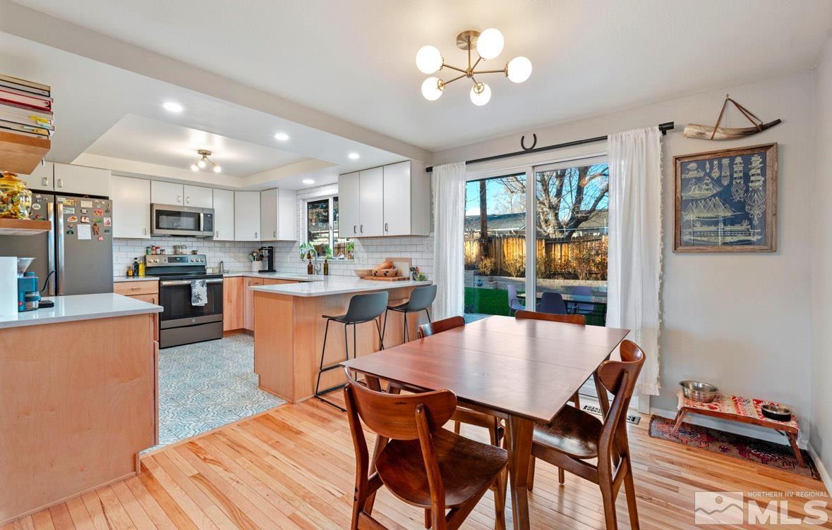 1775 Carlin Street Reno, NV 89503 - Photo 6 of 20 a view of a dining room with furniture window and wooden floor