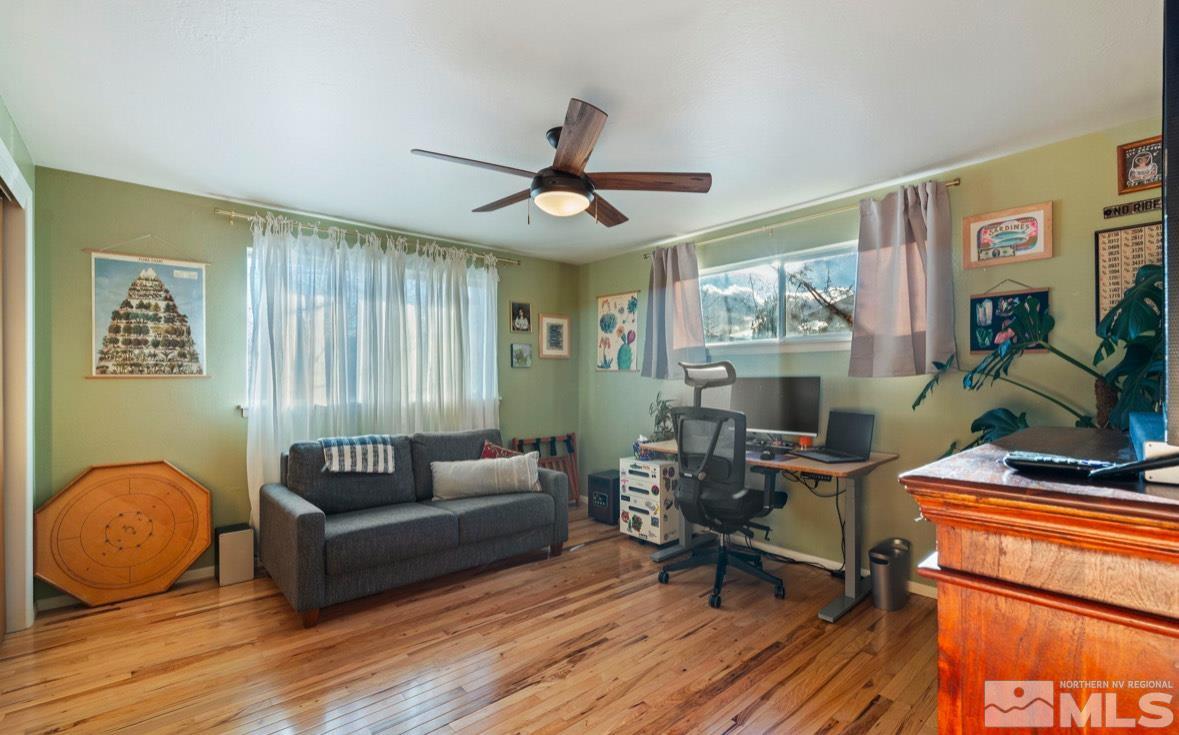 1775 Carlin Street Reno, NV 89503 - Photo 9 of 20 a living room with furniture a ceiling fan and a rug