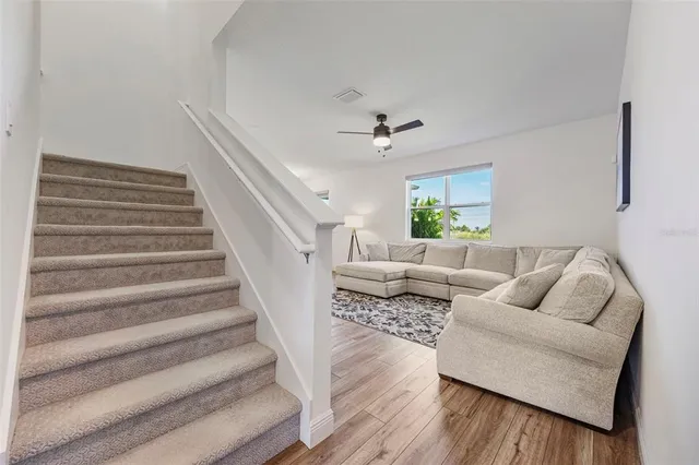 a kitchen with a refrigerator a sink and cabinets