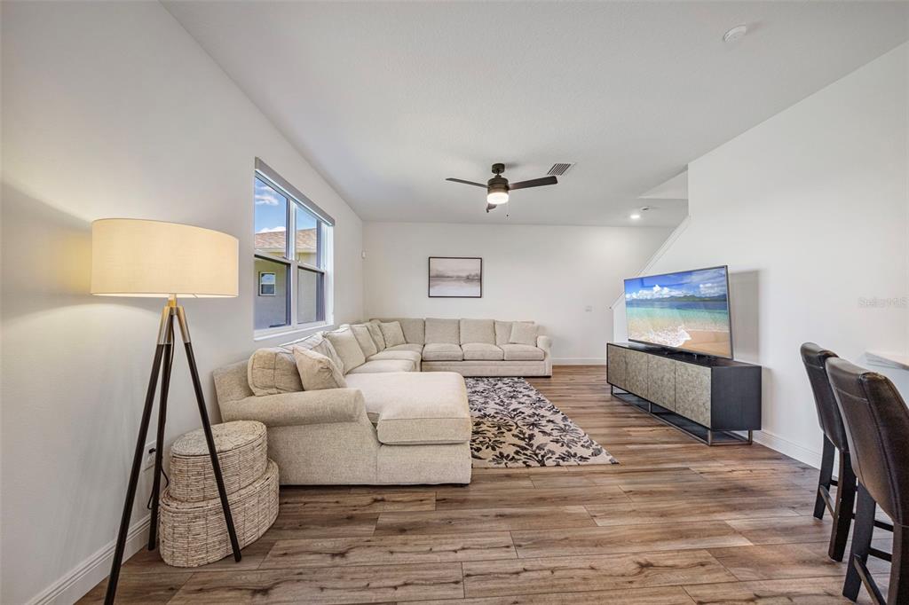 11430 Gallatin Trail Parrish, FL 34219 - Photo 20 of 79 a living room with furniture and a flat screen tv