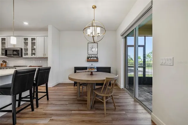 a bedroom with a bed and a flat tv screen on dresser