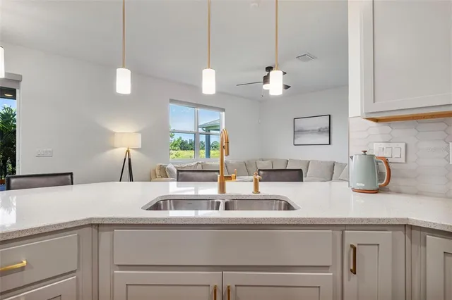 a bedroom with a bed and a refrigerator