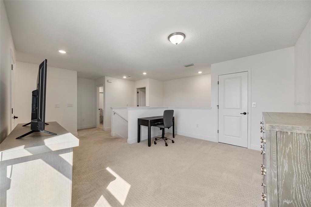 11430 Gallatin Trail Parrish, FL 34219 - Photo 31 of 79 a view of a livingroom with furniture and a flat screen tv