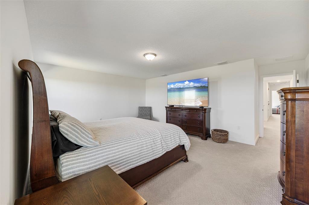 11430 Gallatin Trail Parrish, FL 34219 - Photo 33 of 79 a bedroom with a bed and a television