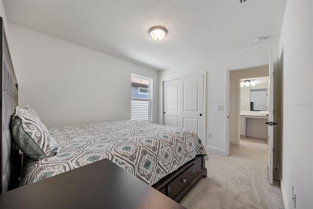 11430 Gallatin Trail Parrish, FL 34219 - Photo 39 of 79 a bedroom with a bed and a refrigerator