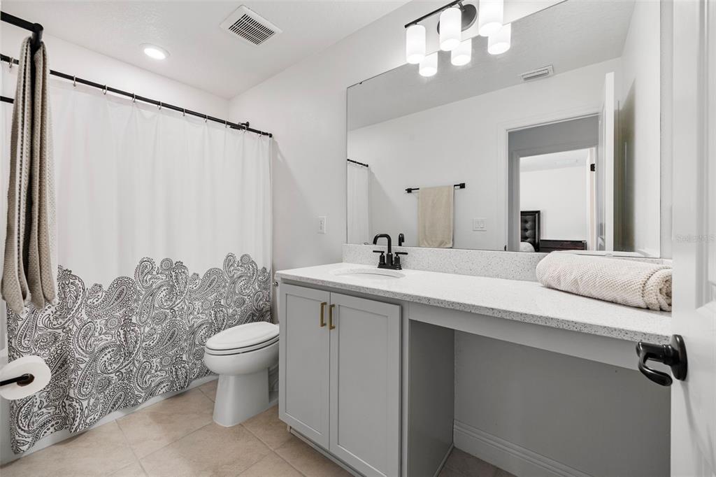 11430 Gallatin Trail Parrish, FL 34219 - Photo 40 of 79 a bathroom with a sink toilet and shower