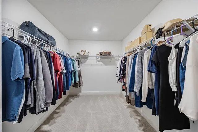 an aerial view of a house with a swimming pool